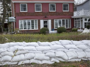 A home on Riverside Drive East in Windsor is surrounded by sandbags to guard the property from high waters levels, on Thursday, April 16, 2020.