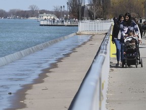 Water from the Detroit River spills over a breakwall at Reaume Park in Windsor on Thursday, April 2, 2020. ERCA is warning of possible flooding in the area.