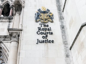 Crest on the wall of Royal Courts of Justice on the Strand in central london. (Getty Images)