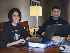 Husband and wife, Teresa and Joe Piskovic, Teresa the head of guidance at Herman Academy and Joe the head of guidance at Riverside Secondary, work at their dining room table, Thursday, April 30, 2020.