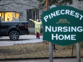 Workers wave at passing cars honking their horns in support for Pinecrest Nursing Home on March 30, 2020. There have been a staggering amount of COVID-19 related illness and deaths at the home in Bobcaygeon, north of Toronto.