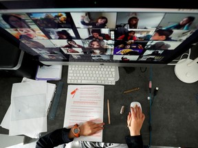 A student takes classes online with his companions using the Zoom APP at home during the coronavirus disease (COVID-19) outbreak in El Masnou, north of Barcelona, Spain April 2, 2020. (REUTERS/ Albert Gea)