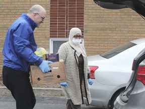Windsor Mayor Drew Dilkens participated in the launch on April 10, 2020, of a volunteer food hamper delivery service organized by the Windsor Islamic Association. The not-for profit service matches anyone in the community, regardless of faith, neighbourhood or income with delivery of food during the pandemic. Calls and orders are collected for two to three days and then volunteers are dispatched from a central point to each make their separate deliveries. Contact WIA at 519-966-2355 or wia@windsormosque.com. Here, Dilkens carries a load of food to volunteer Nada Ayad's car during Friday's launch.