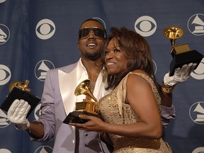 In this Feb. 8, 2006, file photo, Kanye West and his mother Donda West pose with the three awards he won at the Grammy Awards in Los Angeles.