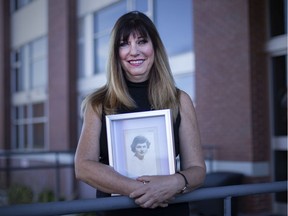 Cindy Armeland Clemens holds a portrait of her late mother, Doris Armeland, Monday, April 27, 2020.