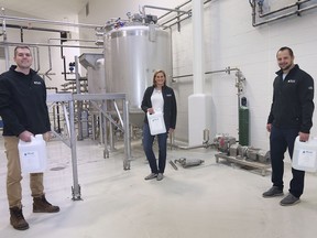 Helping hands in a pandemic. Justin Binder, left, Mary Jo Camboia and Greg Battersby of Peak Processing Solutions in Oldcastle are shown at the business on Wednesday, April 8, 2020. The company will be producing hand sanitizer to help in the fight against COVID-19.