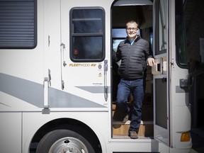 Home away from home — in the driveway. Kingsville's Ken Dunn, a registered respiratory therapist at Erie Shores HealthCare in Leamington, is shown April 6, 2020, exiting a borrowed RV he's staying in next to his home in order to isolate from his wife and two children during the COVID-19 pandemic.