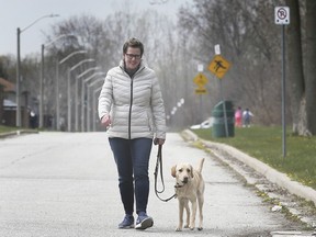 "A great idea." University of Windsor associate professor in kinesiology Sarah Woodruff, shown walking her dog Parlee near her city home on April 24, 2020, says having motorists share the road with pedestrians during COVID-19 is worth investigating. She researches the health and wellness of Canadians and believes physical exercise like walking is important during the coronavirus state of emergency.