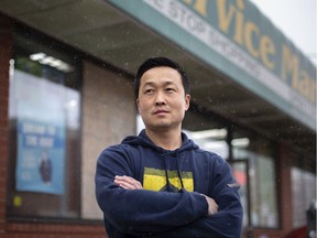 Harris Lee, proprietor of The Service Market convenience store in downtown Windsor, stands outside his business on April 15, 2020.
