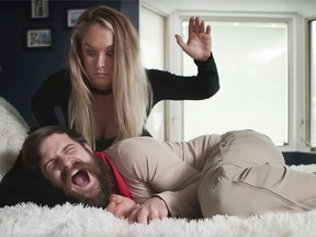 Anti-coronavirus isolation might be causing some to go crazy, but Emma Amlin and Heath Camlis, shown April 8, 2020, are actually acting out a scene from filmmaker Ken Amlin's short film entitled Stay.