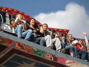 Attendees of the LaSalle Strawberry Festival enjoy a midway ride in June 2012.