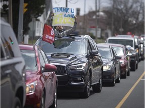 A convoy of vehicles honking their horns with signs of support drove past Windsor Regional Hospital - Ouellette Campus, Tuesday, April 21, 2020.