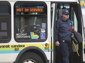 A Transit Windsor driver steps off a bus at the downtown terminal in Windsor on March 26, 2020. Limited service resumes on Monday after a one-month shutdown due to COVID-19.