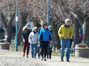 A family takes a walk in the Beaches area of Toronto in this April 2020 file photo.