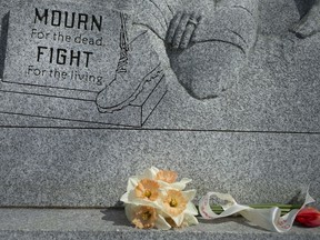 Flowers are shown on Tuesday, April 28, 2020, at the injured and killed workers memorial in Windsor's Coventry Gardens at Reaume Park.