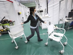 Staff preparing the Windsor Regional Hospital's field hospital at the St. Clair College SportsPlex are shown on Friday, April 17, 2020.