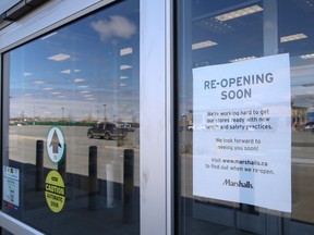 A sign posted at the entrance to Marshalls on Marcus Drive in Sudbury, Ont. on Friday May 15, 2020, said the store will reopen soon. The Government of Ontario said effective May 19, retail stores with dedicated street access can open as long as the business adheres to guidelines issued by the provincial government.
