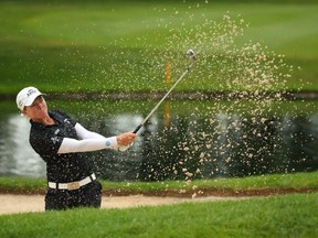 Alena Sharp hits from a sand trap to the fifth green during the final round of the Dow Great Lakes Bay Invitational at Midland Country Club on July 19, 2019 in Midland, Michigan.