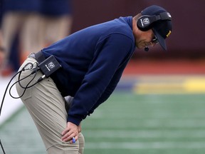 Head coach Jim Harbaugh of the Michigan Wolverines looks on in the first half while playing the Rutgers Scarlet Knights at Michigan Stadium on September 28, 2019 in Ann Arbor, Michigan.