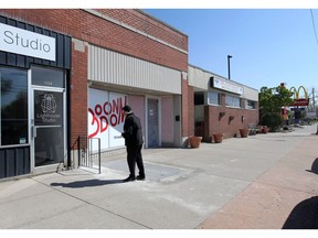 A pedestrian checks out the front entrance of Boondom at 4782 Wyandotte Street East on Tuesday.