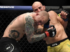 Glover Teixeira, right, of Brazil fights Anthony Smith of the United States in their Light Heavyweight bout during UFC Fight Night at VyStar Veterans Memorial Arena on May 13, 2020 in Jacksonville, Fla.
