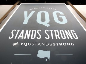 YQG Stands Strong poster in window of Tourism Windsor Essex Pelee Island Wednesday.