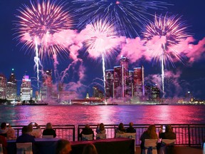 The first shells explode during the Ford Fireworks on the Detroit River.