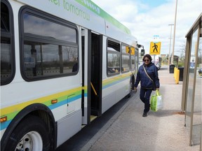 Shelly Davis board the bus from Tecumseh Mall on Monday morning after the city lifted its one-month suspension of the Transit Windsor system over COVID-19 concerns. Bus capacity is now limited to 10 riders plus one person in a wheelchair.