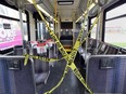 Do Not Enter tape separates riders from the driver aboard a Transit Windsor bus.