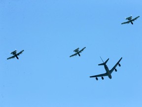 A KC-135 refuelng jet and three A-10 Warthogs fly directly over the Windsor riverfront at Moy Avenue Wednesday.  Four jets from Selfridge Air National Guard Base took part in a Michigan Strong flyover honouring those serving on the COVID-19 frontlines.