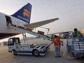 Crew load an Icelander jet with medical supplies bound for Windsor Regional Hospital.