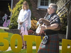Mitch Snaden, with the Windsor Police Pipe Band, helped Julia Holmes celebrate her 50th birthday in style with a bagpipe performance outside her home in South Walkerville, on Friday, May 1, 2020.