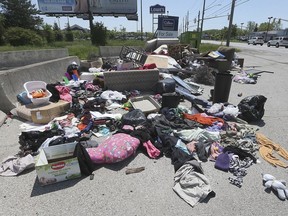 A large pile of items dumped near clothing donation bins on Provincial Road is shown on Tuesday, May 26, 2020. The city will be ramping up enforcement of illegal dumping.