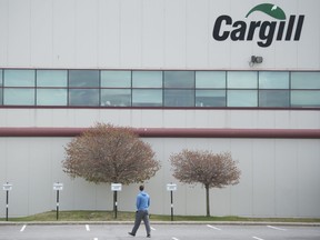 A man walks into a Cargill meat processing factory in Chambly, Que., south of Montreal, Sunday, May 10, 2020.