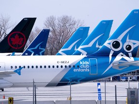 Air Transat and an Air Canada aircrafts are seen on the tarmac at Montreal-Trudeau International Airport in Montreal, on Wednesday, April 8, 2020.