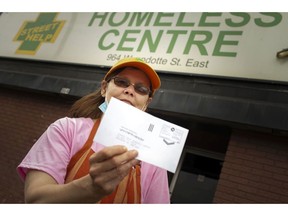 Virginia Wasierski, a volunteer at Street Help Homeless Centre, is pictured with a return envelope for donations, many of which have been gone missing in the postal system, Friday, May 22, 2020.