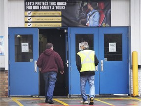 Employees at the FCA Windsor Assembly Plant head into work on Tuesday, May 19, 2020.