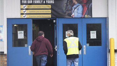 Employees at FCA Windsor Assembly Plant head into work on Tuesday, May 19, 2020. Production resumed on Tuesday after several weeks of lockdown due to the pandemic.