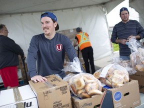Lyle Little, a member of Local 444, helps distribute boxes of food staples at a drive thru food box pick-up location at the Essex Centre Sports Complex, organized by the Unemployed Help Centre of Windsor, Saturday, May 16, 2020.