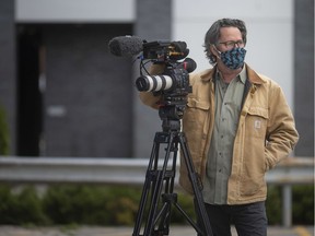 Windsor-born documentary maker Matt Gallagher is pictured with a mask and his camera on May 5, 2020. Gallagher's current project examines the interactions between patients of the COVID-19 field hospital on the St. Clair College campus and their loved ones.