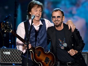 Recording artists Paul McCartney, left, and Ringo Starr perform onstage during "The Night That Changed America: A GRAMMY Salute To The Beatles" at the Los Angeles Convention Center on Jan. 27, 2014, in Los Angeles.