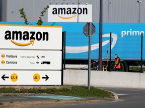 FILE PHOTO: The logo of Amazon is seen at the company logistics center in Lauwin-Planque, northern France, April 22, 2020 after Amazon extended the closure of its French warehouses until April 25 included, following dispute with unions over health protection measures amid the coronavirus disease (COVID-19) outbreak.