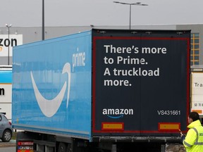 A truck with the logo of Amazon Prime Delivery arrives at the Amazon logistics center in Lauwin-Planque, northern France, March 19, 2020.