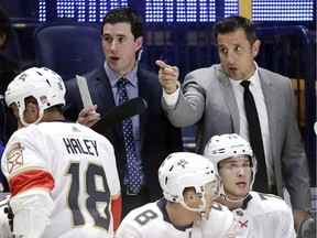 Former Windsor Spitfires' captain Paul McFarland, at left, is seen on the bench former Spitfires' head coach Bob Boughner on the Florida Panthers' bench. McFarland is returning to junior hockey.