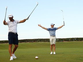 Rory McIlroy and Dustin Johnson of the American Nurses Foundation team react on the 17th tee after winning the closest to the pin playoff against Rickie Fowler of the CDC Foundation team and Matthew Wolff of the CDC Foundation team during the TaylorMade Driving Relieve Supported By UnitedHealth Group on May 17, 2020, at Seminole Golf Club in Juno Beach, Fla.