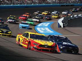 Joey Logano and Alex Bowman lead during the NASCAR Cup Series FanShield 500 at Phoenix Raceway on March 08, 2020 in Avondale, Arizona.