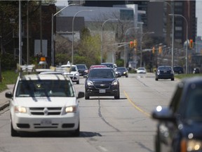Traffic moves along Riverside Drive East between downtown and Devonshire Road, Monday, May 4, 2020.  Council has voted against reducing Riverside Drive down to two lanes from Caron Avenue to Devonshire Road.