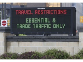 A sign at the Windsor/Detroit tunnel entrance in Windsor, ON. is shown on Tuesday, May 19, 2020.