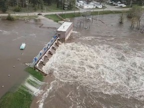 An aerial view of flooding as water overruns Sanford Dam, Michigan, U.S. in this May 19, 2020 still frame obtained from social media video.