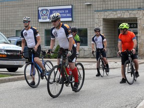 Essex-Windsor EMS paramedics Andrew Peters, left, Mike Lacroix and Chief Bruce Krauter, right, and other riders begin the Amherstburg-to-LaSalle leg of the Paramedics Ride Wednesday. EMS paramedics and their spouses rode bicycles across Windsor and Essex County accompanied by a Memorial Bell honouring all fallen paramedics, combat medics and search and rescue technicians. They are raising money to build a monument in Ottawa that recognizes fallen Paramedics.